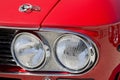 Detail of an headlight of a vintage italian red sport car Royalty Free Stock Photo