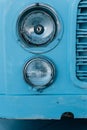 Detail of the headlights of a vintage bus parked in a skate park Royalty Free Stock Photo