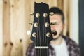 Detail of a headstock of a classical guitar. Music and guitarist