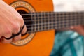 Detail Hippy man playing guitar outdoors on the sand Royalty Free Stock Photo