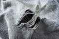 Detail of hole in blue jeans Royalty Free Stock Photo