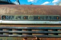Detail of the hood emblem on a rare antique Canadian Maple Leaf Truck in a junkyard in Cassiar, British Columbia, Canada