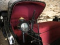 Detail of horse-drawn black leather padded coach of Calesh type.