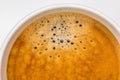 Detail of hot black coffee with foam bubbles in white cup with w Royalty Free Stock Photo