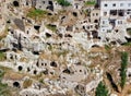 detail of the houses carved in the stone, living caves, Ortahisar, typical village carved in rock and stone, Cappadocia, Anatolia