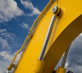 Detail of hydraulic bulldozer piston excavator arm on sky backg Royalty Free Stock Photo