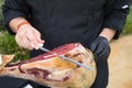 Detail of an Iberian ham cut by a professional. Concept pork, food, ham, iberian, spain, denomination of origin