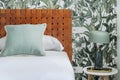 Detail image of a bedroom with woven brown leather headboard Royalty Free Stock Photo