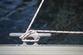 Detail image of yacht rope cleat on sailboat deck Royalty Free Stock Photo