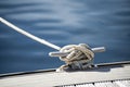 Detail image of yacht rope cleat on sailboat deck Royalty Free Stock Photo