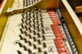 Detail of the interior of a piano with the soundboard, strings and pins Royalty Free Stock Photo