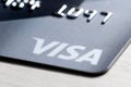 Detail of an international payment card with the Visa logo shot close-up