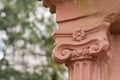 Detail of the ionic capital of a sandstone column Royalty Free Stock Photo