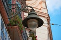 Detail of iron lighting lamppost with floral decorations Royalty Free Stock Photo