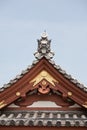 Detail on japanese temple roof against blue sky. Royalty Free Stock Photo