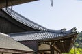 Detail on japanese temple roof against blue sky Royalty Free Stock Photo