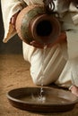 Detail of Jesus pouring water Royalty Free Stock Photo