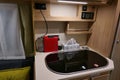 Detail of kitchen corner in modern german pick up camper van module Tischer Trail 250 - covered kitchen sink and cooker visible.