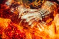 Detail knight armor. Gloves of a knight. Fire effect. Royalty Free Stock Photo