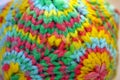 Coloful detail of a knitted yarn polygon figure