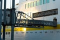 Detail of landing gangway connected to open door of cruise ship docked in the old port Royalty Free Stock Photo