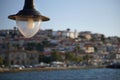 Detail of a lantern on the blurred background of the beautiful port of Koroni, south west Peloponnese