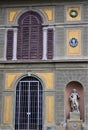 Detail, with large door and windows, of the wall facing the park, near the entrance, of the beautiful villa Montughi or Stibbert. Royalty Free Stock Photo