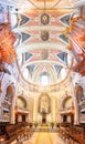 detail of the lateral altar and part of the dome, ceiling and musical organs inside the Lisbon Cathedral. Royalty Free Stock Photo