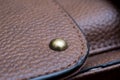 Detail of a leather bag close-up. Leather metal buckle on bag