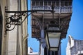 Detail lf a traditional lamp post with the Santa Justa Lift Elevador de Santa Justa on the background in Lisbon