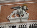 Detail of a lion statue on Doge`s Palace on St Marks Square in Venice Royalty Free Stock Photo