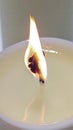 detail of a lit wick of a candle, prayer concept Royalty Free Stock Photo