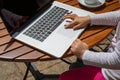 Detail of little girl finger hand surfing on laptop trackpad