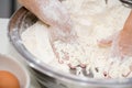 Detail of a Little Hand of a kid Making Cake Bakery in Kitchen with Flour. Infant Chef Concept
