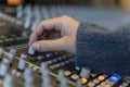 Macro shot of a hand in a control panel of a music recording studio Royalty Free Stock Photo