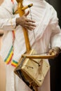 Male performer playing a Masenqo single stringed bowed lute