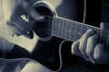 Detail of a man playing an acoustic guitar, duotone color Royalty Free Stock Photo