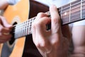 Detail of man playing acoustic guitar Royalty Free Stock Photo