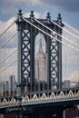 Detail of the Manhattan Bridge with the Empire State Builing on the background, in the city of New York City