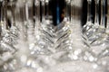 Detail of many clear and clean glass glasses arranged on the table of a bar to serve wine