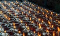 Detail of Many red votive candles light with shallow depth of field inside Chinese temple Royalty Free Stock Photo