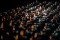 Detail of Many red votive candles light with shallow depth of field inside Chinese temple Royalty Free Stock Photo