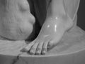 Detail of a marble statue, depicting the foot. Close up of the toes on a foot of an old stone sculpture