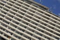 Detail of massive old block of flats with many apartments with balconies Royalty Free Stock Photo