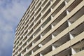 Detail of massive old block of flats with many apartments with balconies Royalty Free Stock Photo