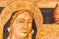 Detail of medieval painting showing the head of a blond european female saint