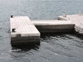 Small stone dock with old bollards for mooring ships on sea