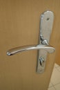 Metail door handle on a modern door Royalty Free Stock Photo