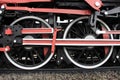 Detail of the metal wheels of the train locomotive.