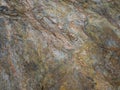 Detail of Metamorphic rocks with colorful mineral streaks. Tex